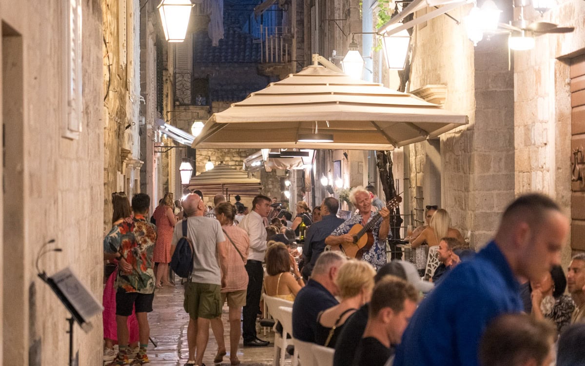 A musician serenading diners, Prijeko Street, Dubrovnik, Croatia