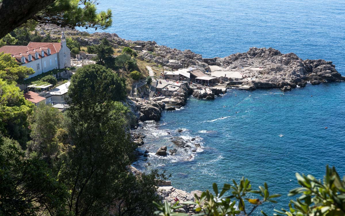 The rocky Danče Beach and the Church of St. Mary, Gradac Park, Dubrovnik, Croatia